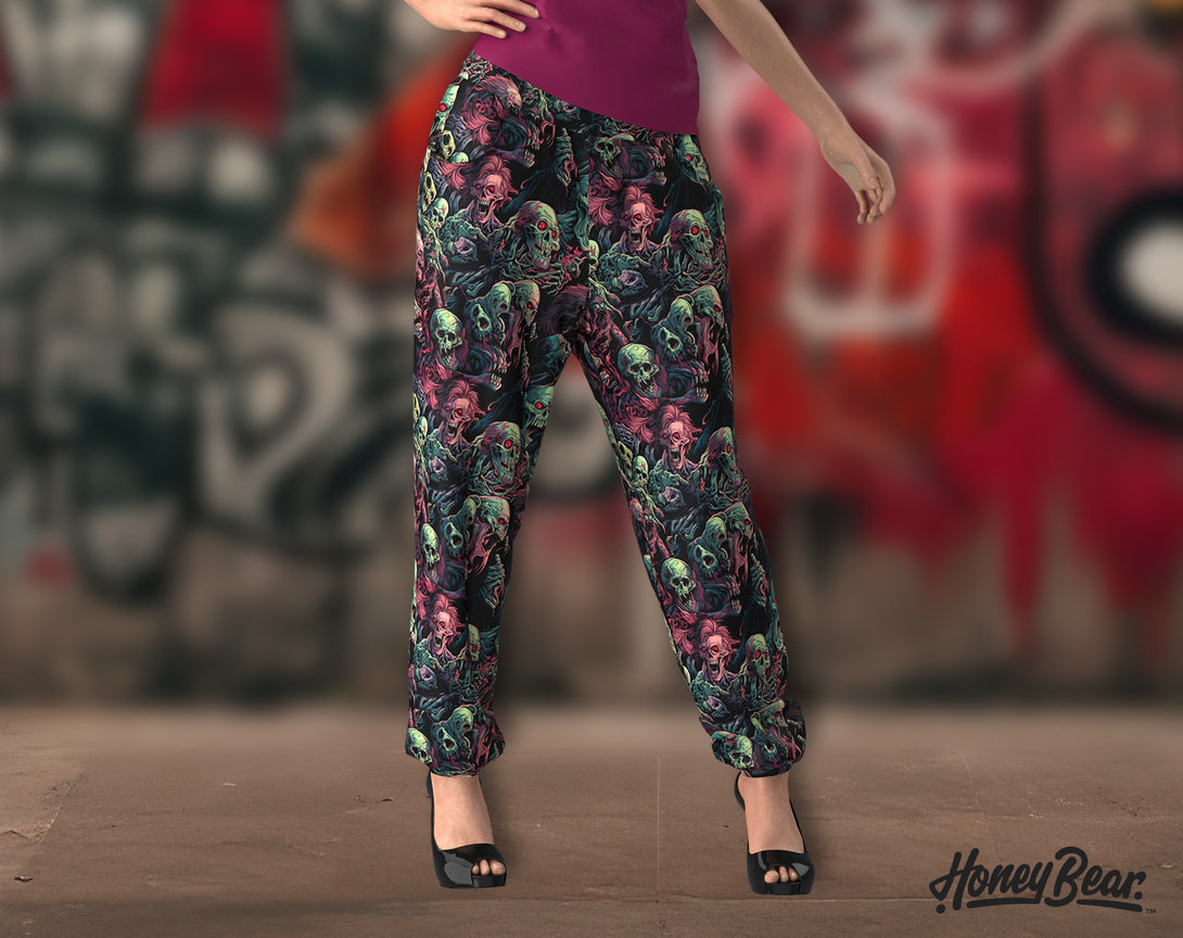 woman wearing Creepy Undead Jogger Pants with Zombies faces pattern