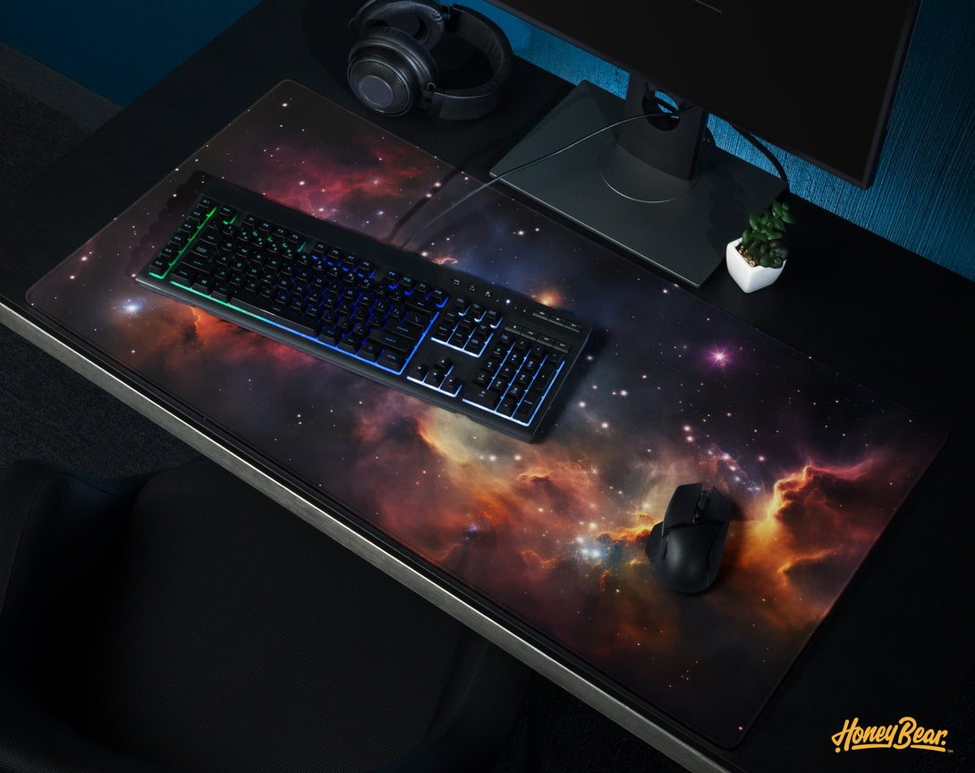 Expansive Honey Bear galaxy-themed desk mat featuring a mesmerizing nebula with stars and cosmic clouds, perfect for adding a celestial feel to any workstation