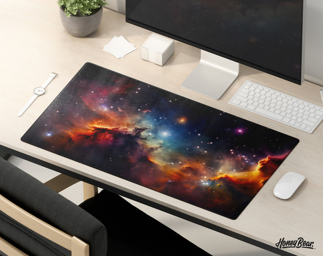 Starry nebula desk mat with vibrant cosmic cloud patterns, enhancing the ambiance of a gaming setup with its deep space visuals – Honey Bear