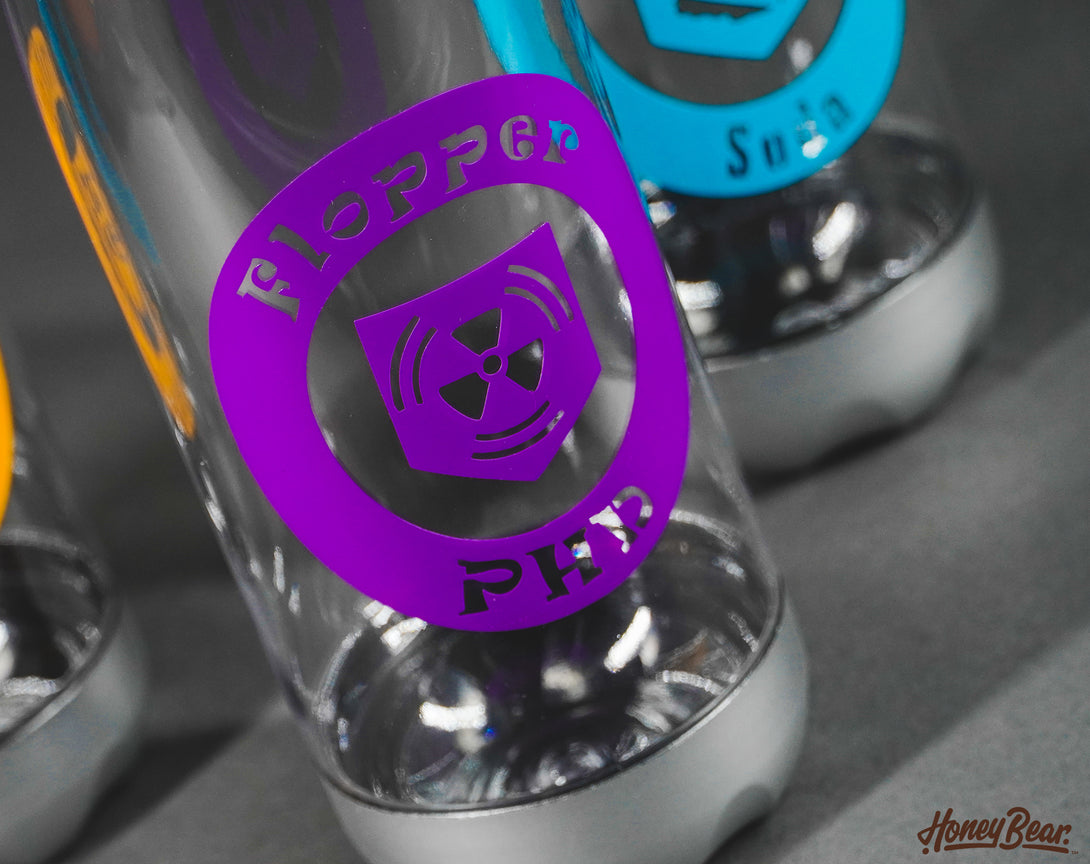 Close-up of a gaming-themed hydration bottle, adorned with weatherproof decals from zombie games.