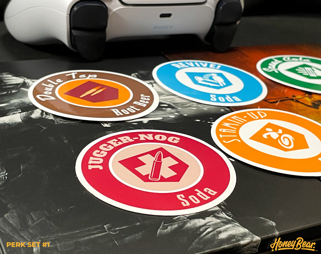 Collection of vinyl stickers featuring iconic perks from popular zombie survival games, perfect for personalizing electronics.